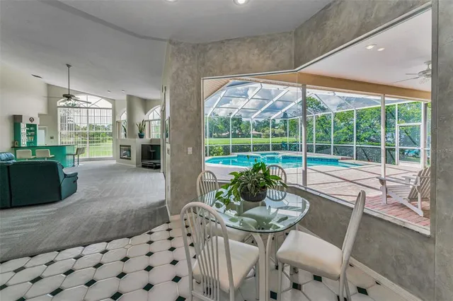 a living room with furniture window and a flat screen tv