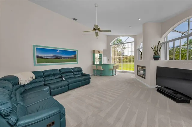 a bedroom with a large bed and a flat tv screen