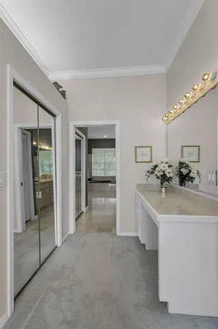 a living room with furniture cabinets and window