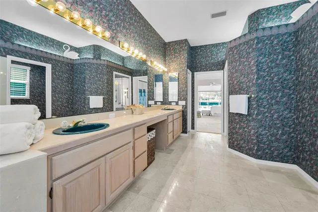 a living room with flat screen tv and a window