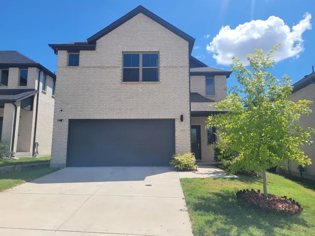 a front view of house with yard