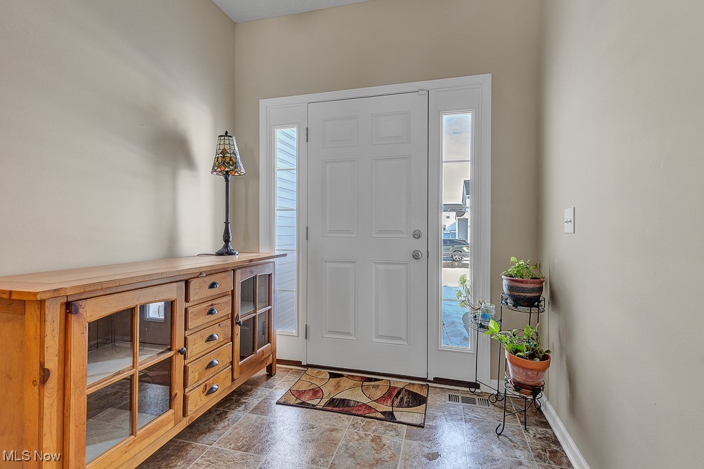 37289 Sandy Ridge Drive North Ridgeville, OH 44039 - Photo 2 of 21 Foyer featuring a wealth of natural light