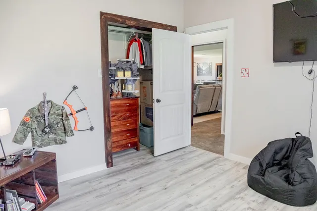 a spacious bathroom with a double vanity sink a mirror and a