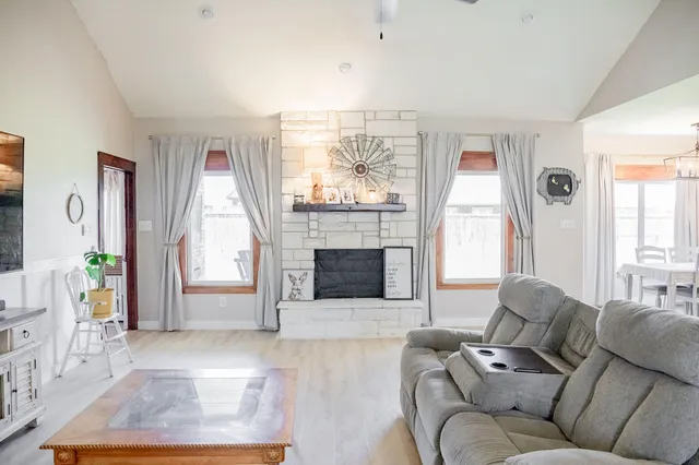 a living room with furniture and a fireplace