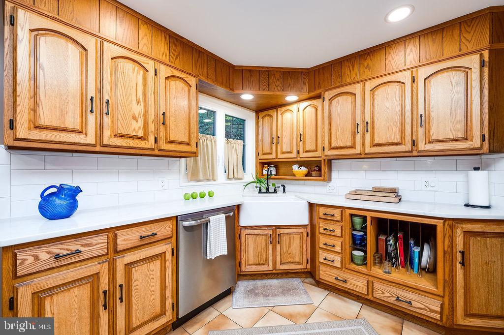 199 Deer Hill Lane Reading, PA 19607 - Photo 16 of 65 a kitchen with stainless steel appliances granite countertop a cabinets and a stove top oven