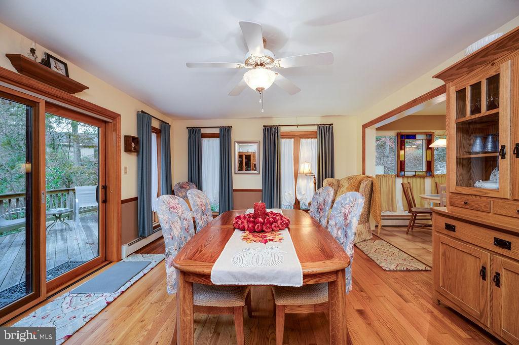 199 Deer Hill Lane Reading, PA 19607 - Photo 23 of 65 a dining room with furniture a rug and wooden floor