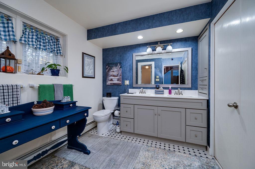 199 Deer Hill Lane Reading, PA 19607 - Photo 24 of 65 a spacious bathroom with a sink mirror and vanity