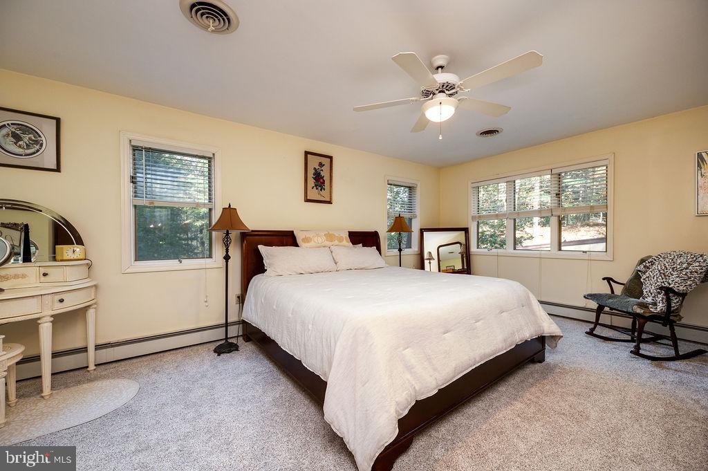 199 Deer Hill Lane Reading, PA 19607 - Photo 28 of 65 a bedroom with a large bed and a window