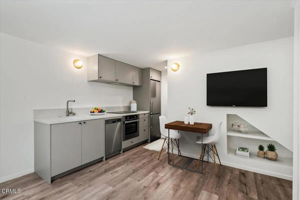 3181 Verdugo Place, Unit 3183 5 Los Angeles, CA 90065 - Photo 2 of 15 a kitchen with a sink and a stove top oven