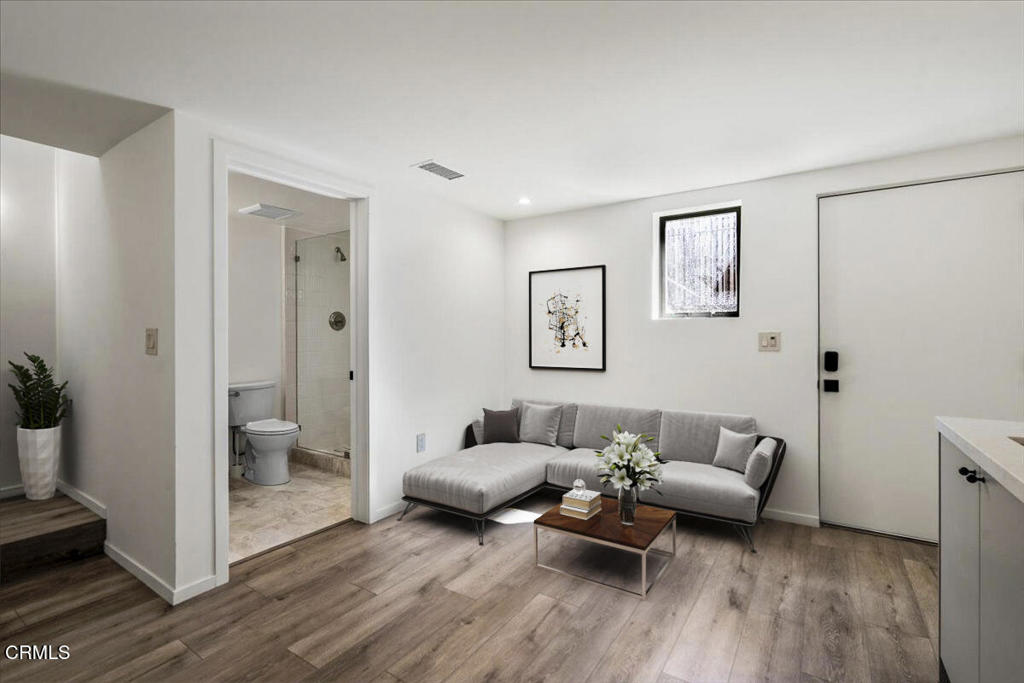 3181 Verdugo Place, Unit 3183 5 Los Angeles, CA 90065 - Photo 4 of 15 a living room with furniture and a wooden floor
