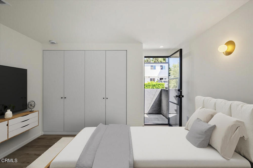 3181 Verdugo Place, Unit 3183 5 Los Angeles, CA 90065 - Photo 10 of 15 a bedroom with a bed and flat tv screen on the dresser