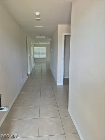 a view of hallway with closet and entryway