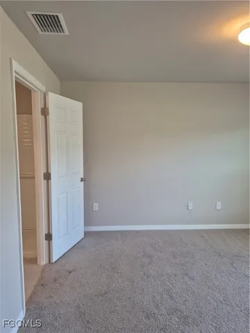 a kitchen with kitchen island a counter top space cabinets and stainless steel appliances