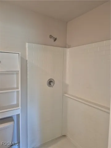 a view of a porch with furniture and garden