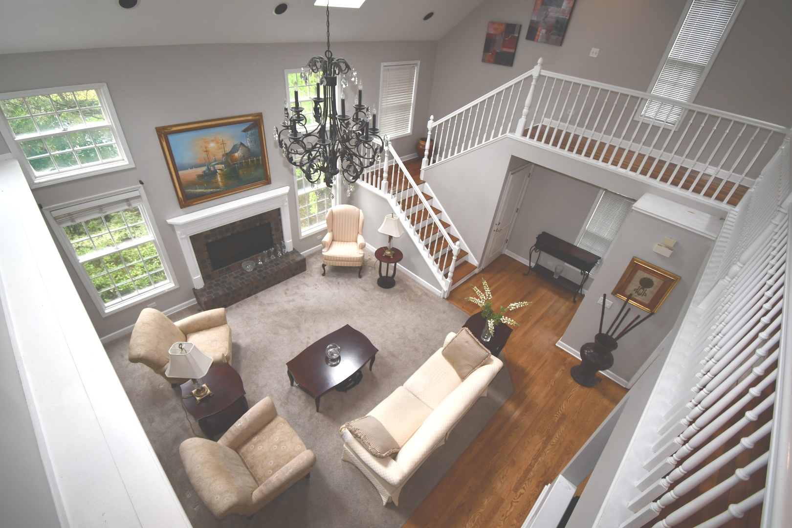2174 Brookside Lane Aurora, IL 60502 - Photo 16 of 32 a living room with furniture and a chandelier