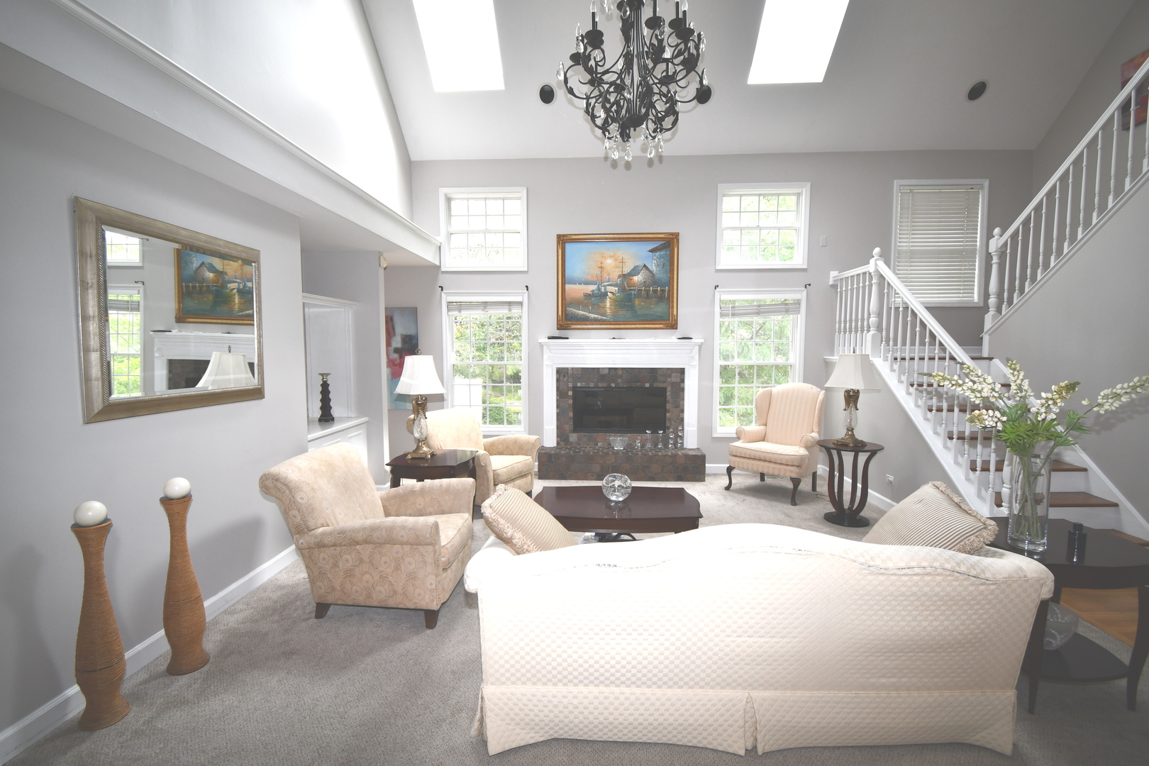 2174 Brookside Lane Aurora, IL 60502 - Photo 8 of 32 a living room with furniture a chandelier and a fireplace