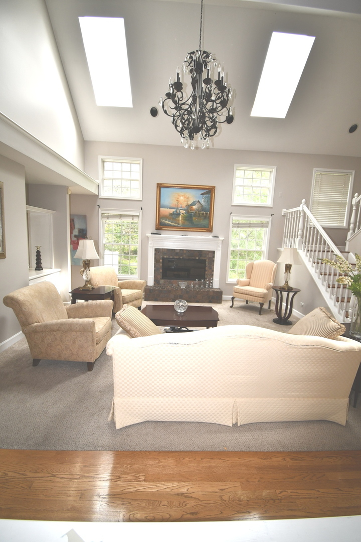 2174 Brookside Lane Aurora, IL 60502 - Photo 9 of 32 a living room with furniture chandelier and window
