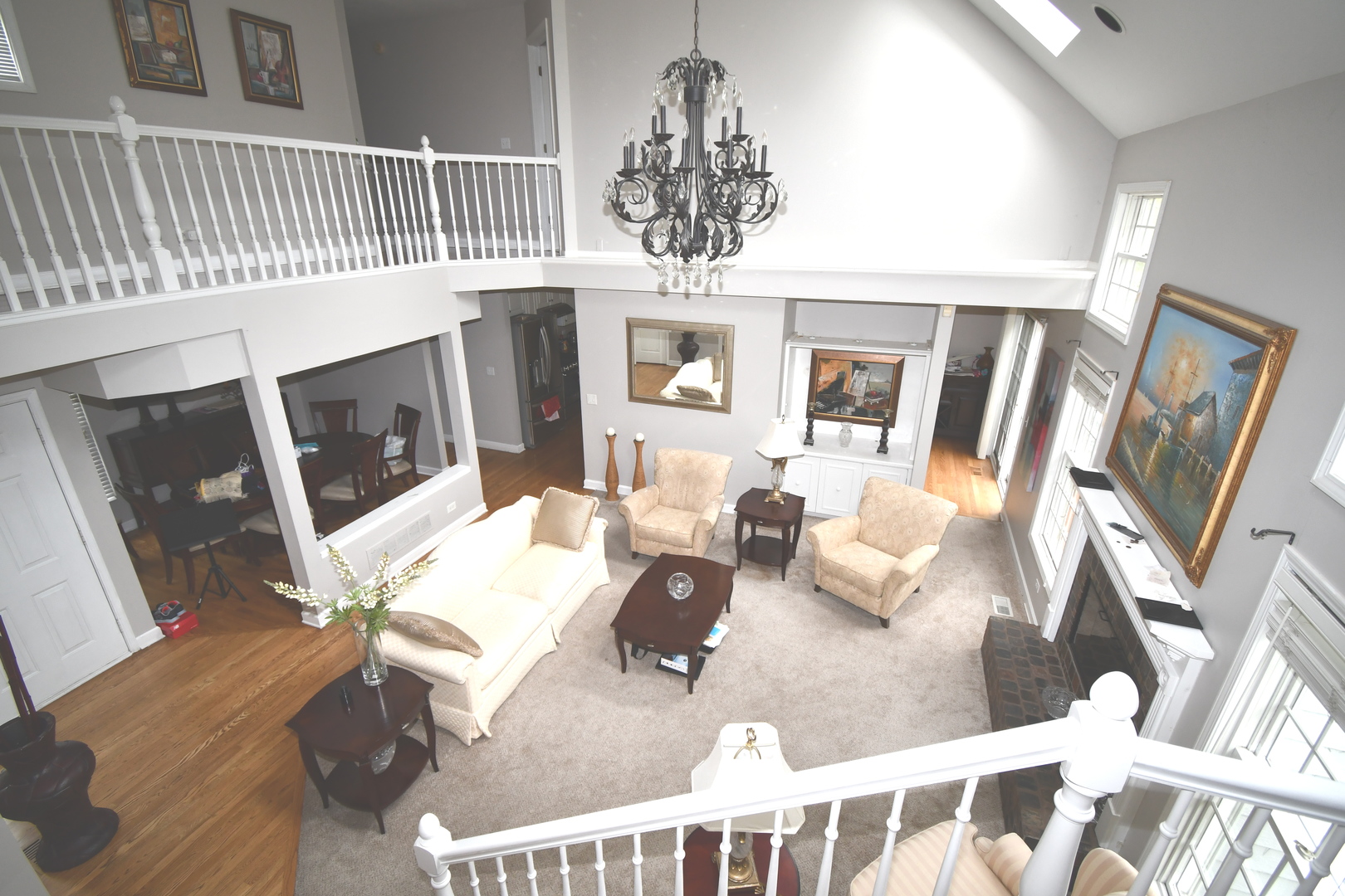 2174 Brookside Lane Aurora, IL 60502 - Photo 10 of 32 a living room with furniture and a chandelier