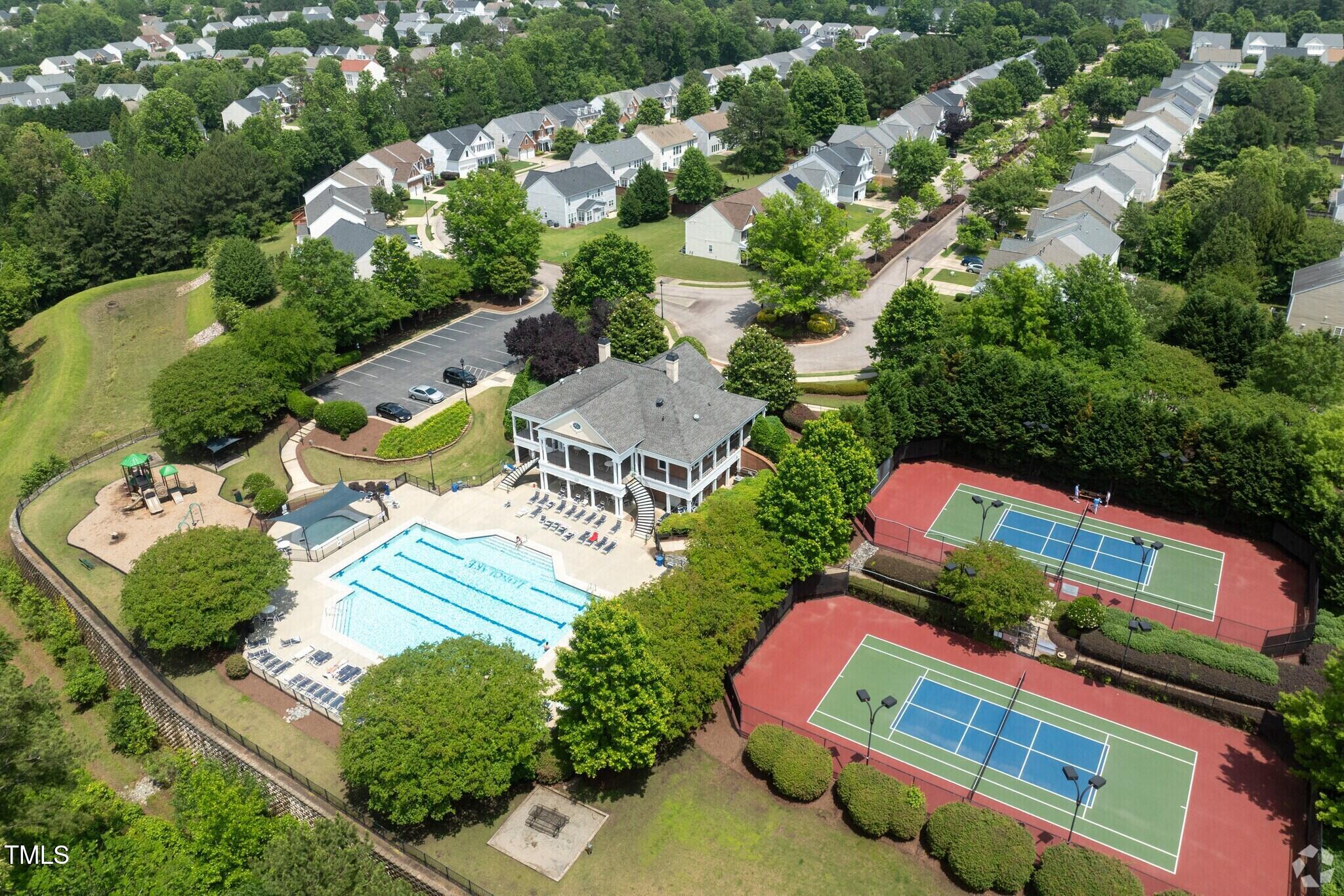 7440 Lagrange Drive Raleigh, NC 27613 - Photo 38 of 38 Long Lake has a community club house with a pool, playground and tennis courts available for residents.