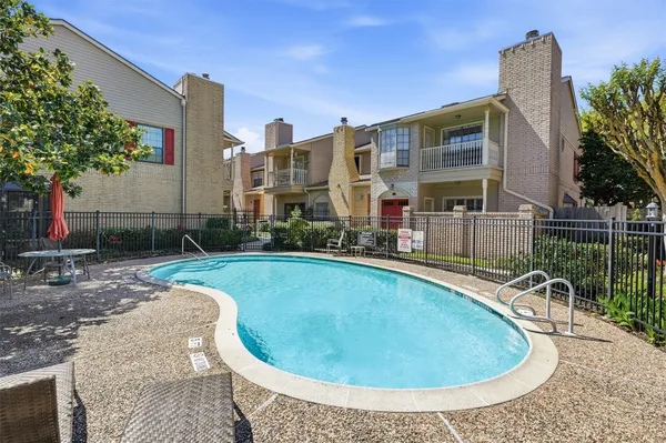 a view of a swimming pool with a patio