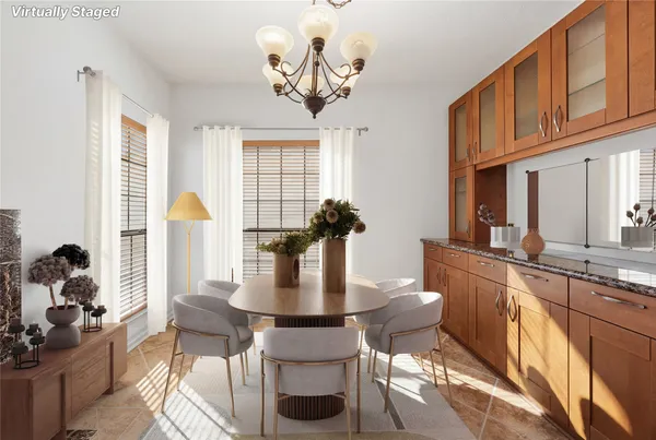 a dining room with furniture a chandelier and wooden floor