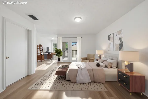 a living room with a bed and a couch