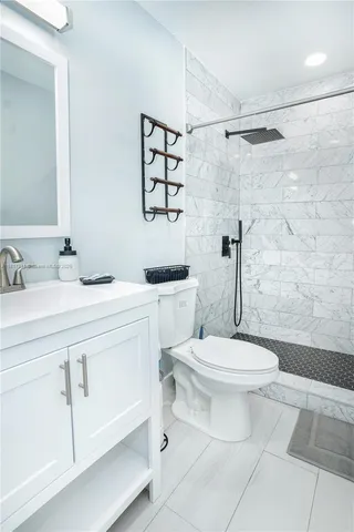 a bathroom with a toilet sink and shower