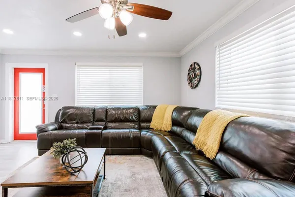 a living room with furniture and a large window
