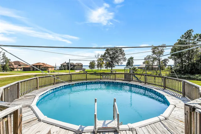 a view of a swimming pool with a patio