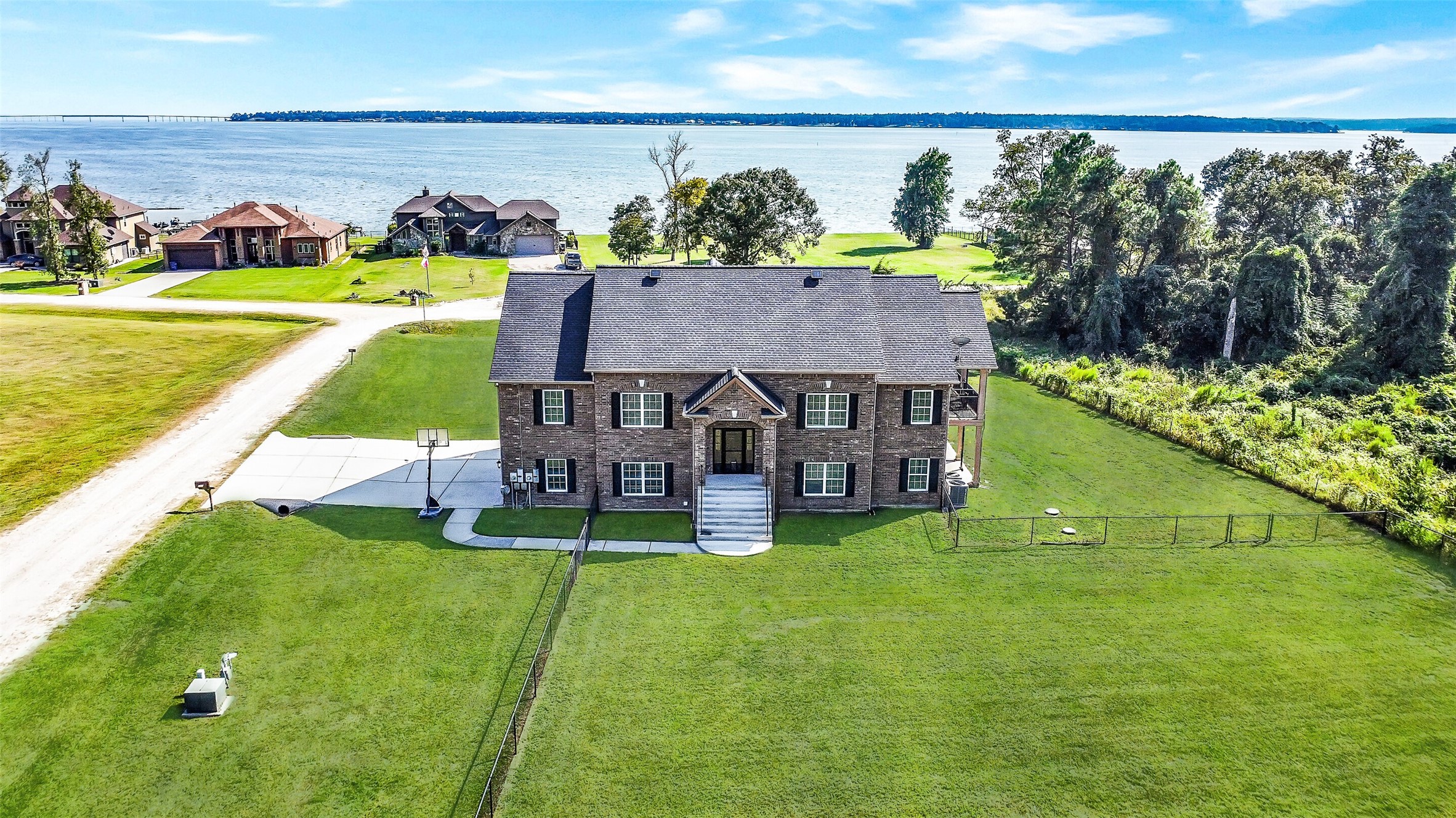 an aerial view of a house with swimming pool garden and outdoor seating