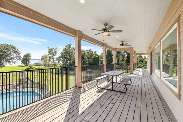 a view of a balcony with wooden floor