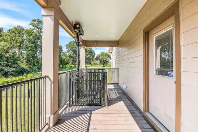a view of a balcony with wooden floor