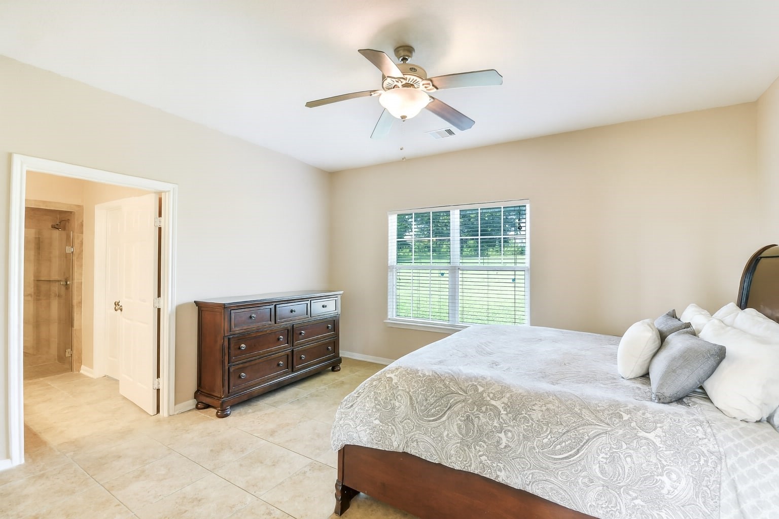 264 Falcon Point Onalaska, TX 77360 - Photo 21 of 33 a bedroom with a bed and window
