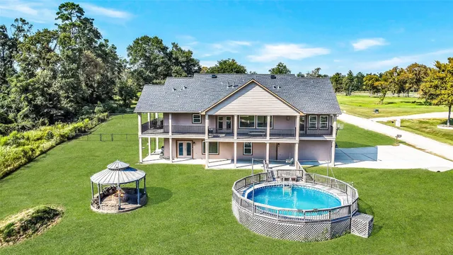 a front view of a house with a yard table and chairs
