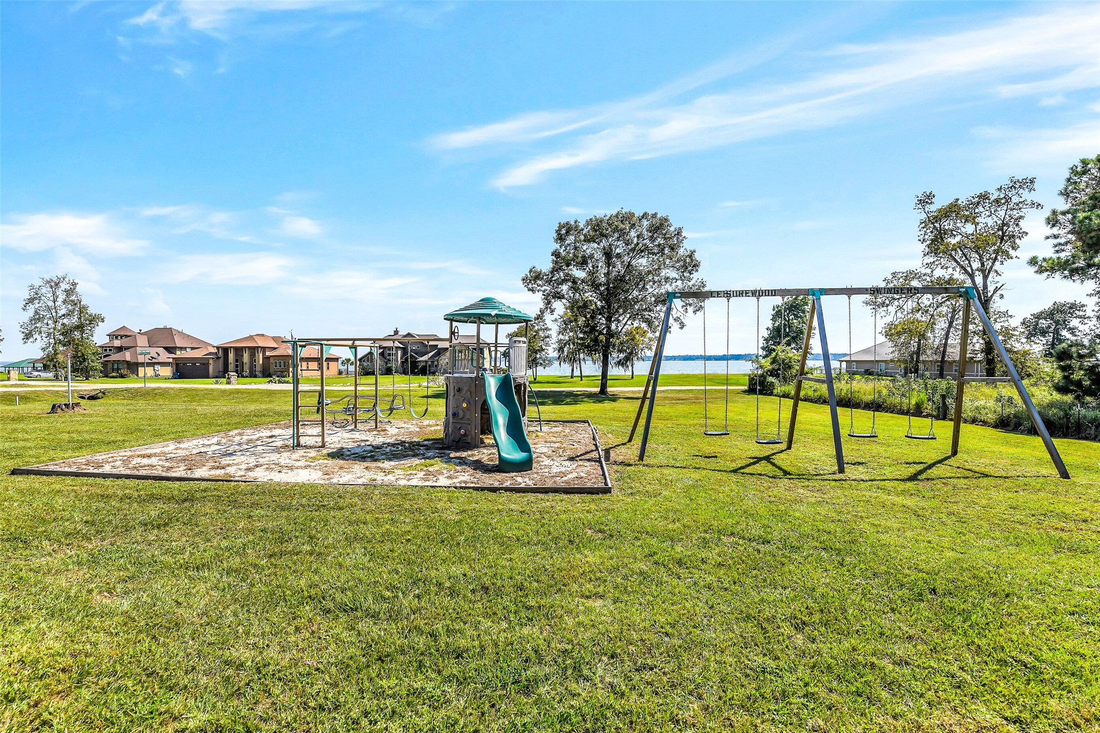 264 Falcon Point Onalaska, TX 77360 - Photo 28 of 33 a view of a swimming pool with a yard and seating area