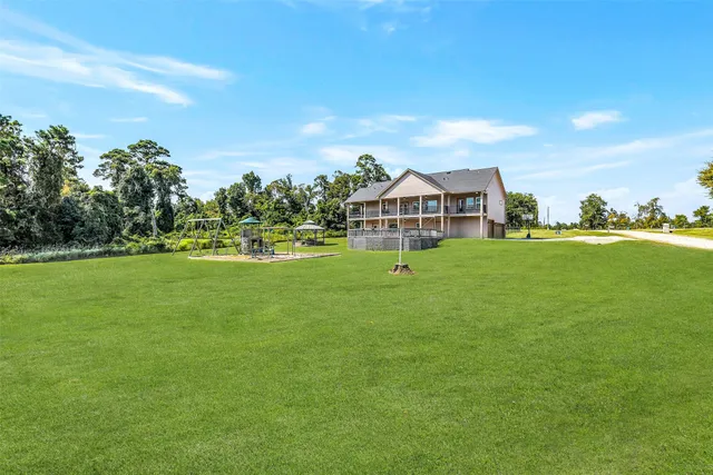 a view of a patio with wooden floor