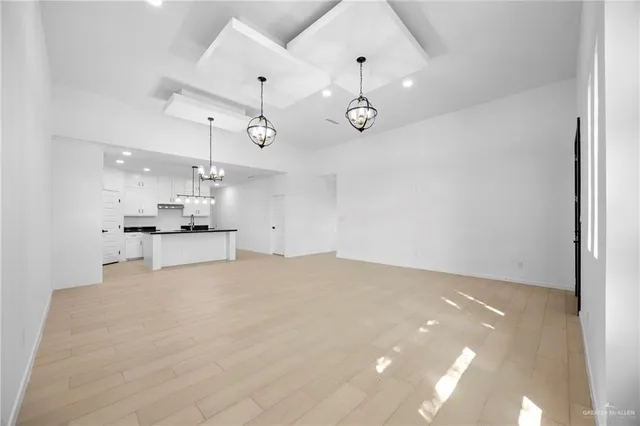 a view of kitchen with refrigerator and window