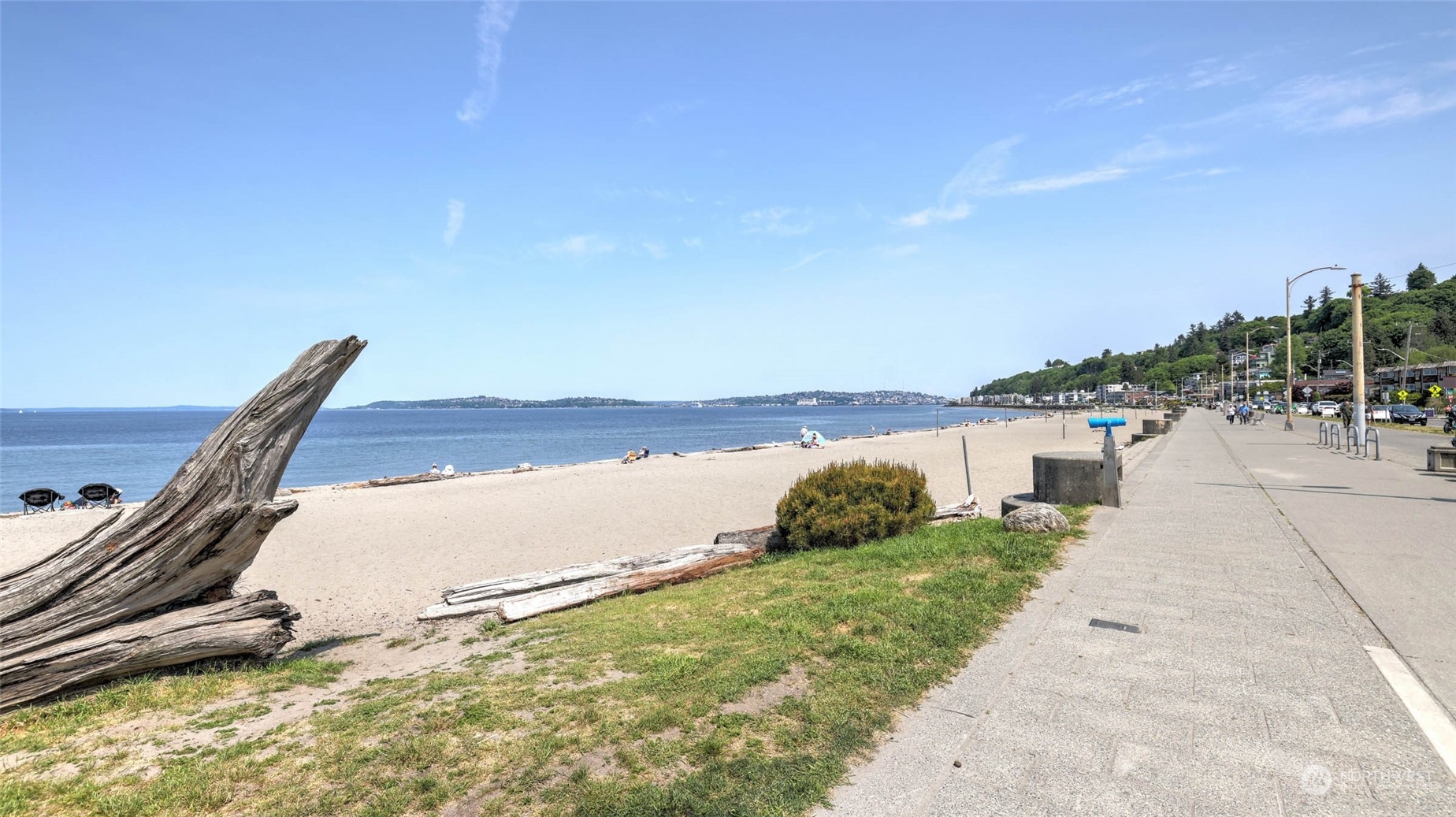2514 57th Avenue Southwest, Unit 102 Seattle, WA 98116 - Photo 2 of 18 a view of a yard with an ocean view