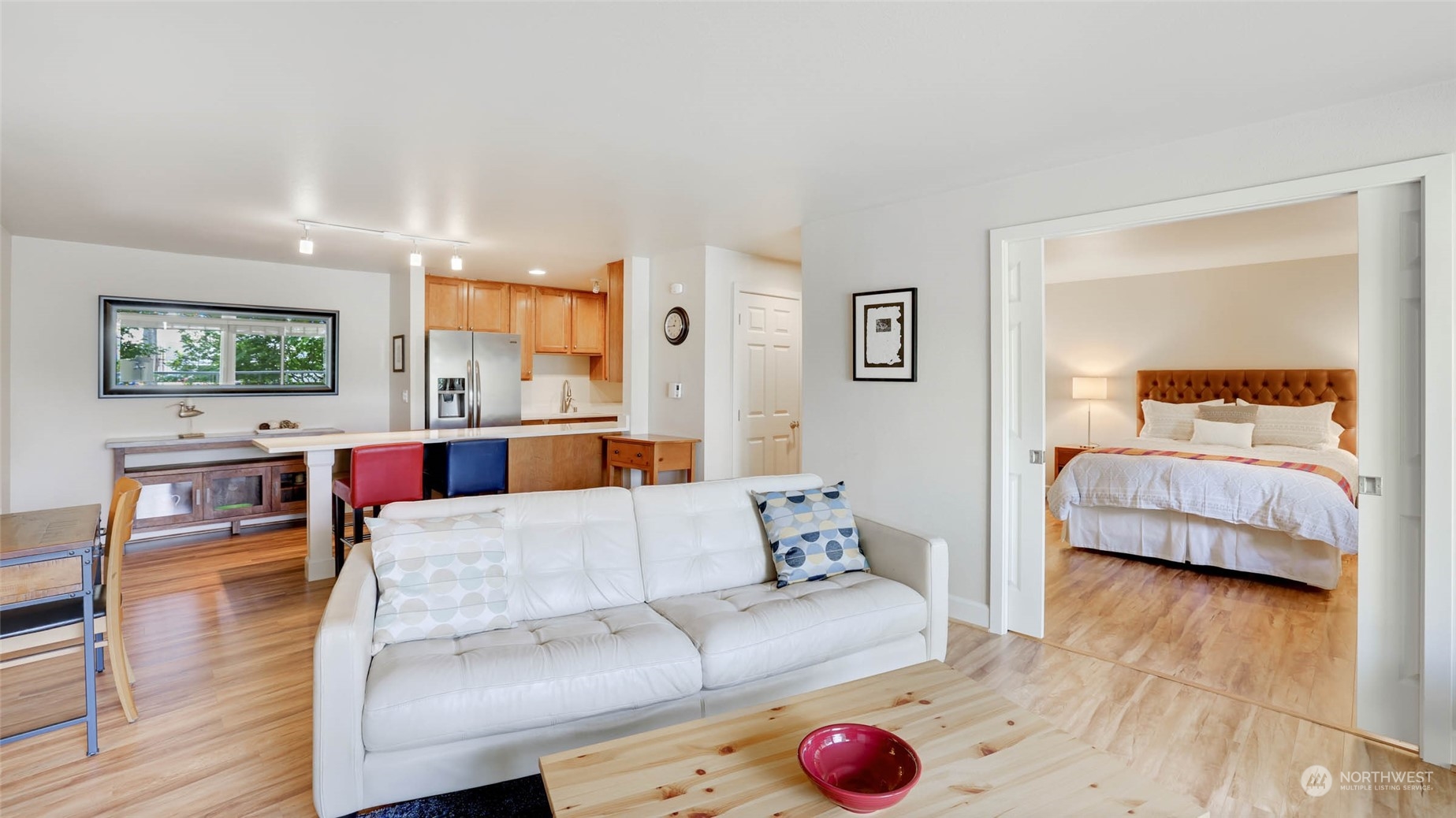 2514 57th Avenue Southwest, Unit 102 Seattle, WA 98116 - Photo 7 of 18 a living room with furniture and a wooden floor