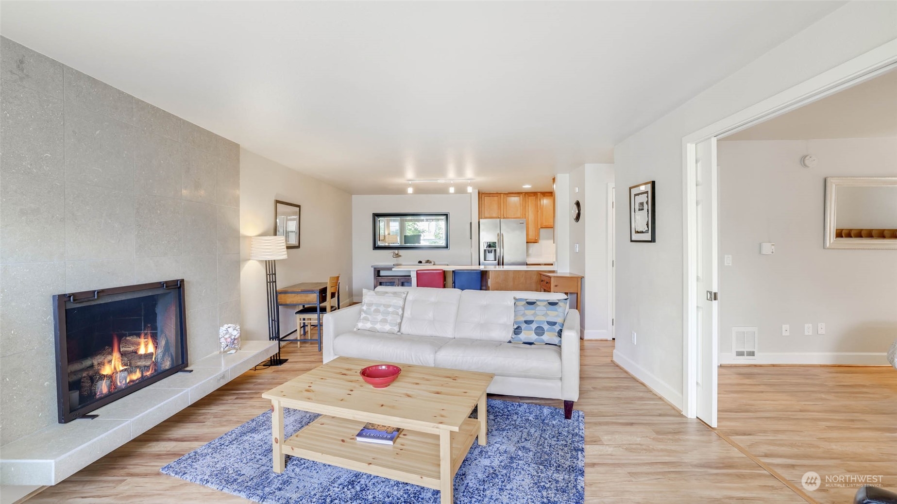 2514 57th Avenue Southwest, Unit 102 Seattle, WA 98116 - Photo 8 of 18 a living room with furniture and a fireplace