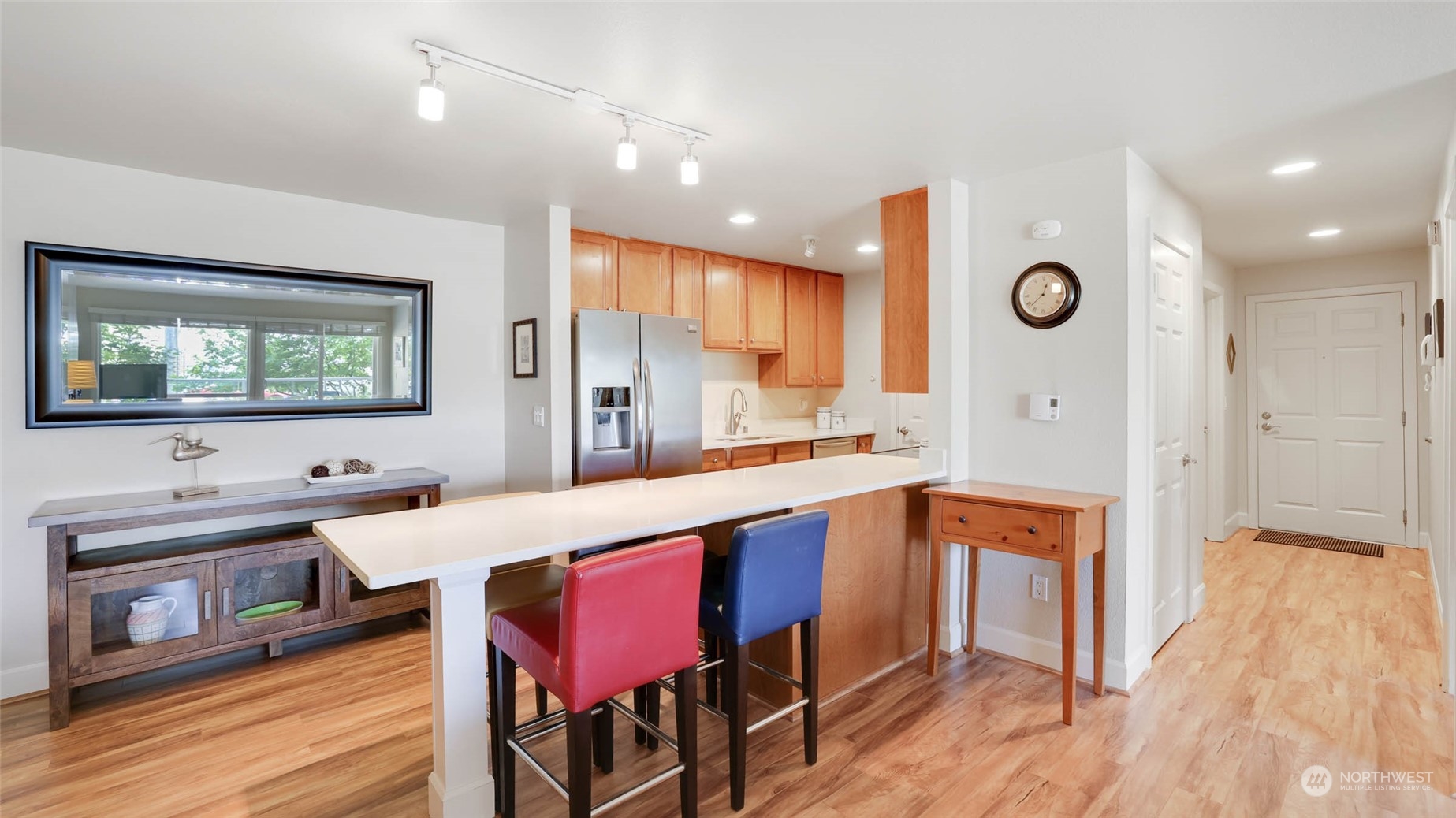 2514 57th Avenue Southwest, Unit 102 Seattle, WA 98116 - Photo 9 of 18 a large kitchen with a table and chairs