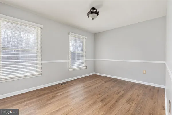 a view of a livingroom with wooden floor