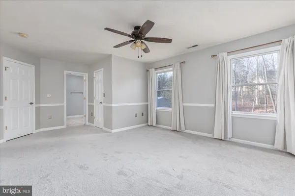 a room with stairs and a wooden floor
