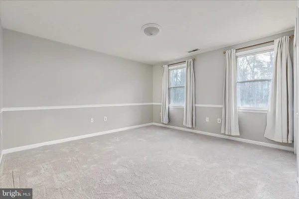 a view of a storage & utility room with racks a book shelf