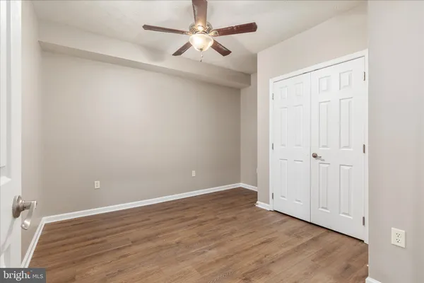 a view of a park with large trees