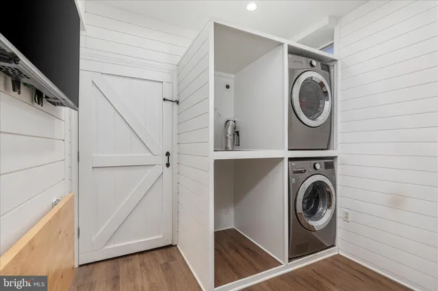 a view of a house with a yard patio and fire pit
