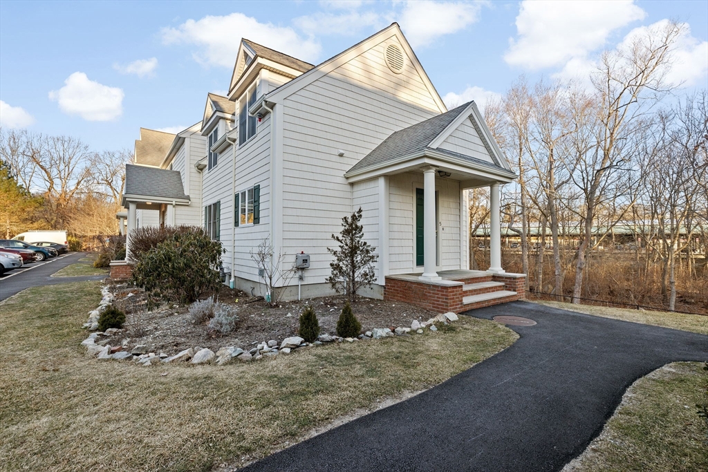 196 Summer Street, Unit 5 Hingham, MA 02043 - Photo 1 of 1 a front view of a house with garden