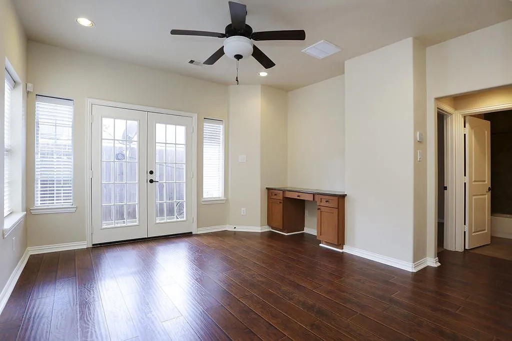 5615 Winsome Lane, Unit H Houston, TX 77057 - Photo 15 of 24 a view of empty room with wooden floor and fan