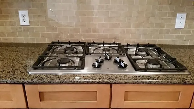 a view of a kitchen with furniture and wooden floor