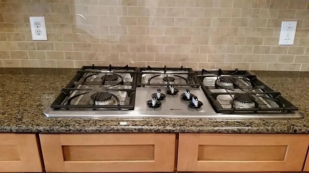 5615 Winsome Lane, Unit H Houston, TX 77057 - Photo 7 of 24 a bathroom with a granite countertop sink and a mirror